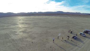 Drone shot of film shoot in the desert with hyper martial arts. CaveLight Films behind the scenes. Beautiful film shoot set up with permits.