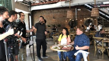 Travel Channel, Man v. NYC, Behind the Scenes, Casey Webb from man vs food and Vivian Chan from food network battle it out to see who knows NYC best. Branded content.Production services, original content, filming and editing, CaveLight Films. Restaurant with outdoor seating. Filming for travel channel.