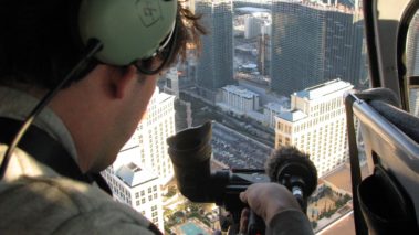 Ariel film shot from helicopter. Director of CaveLight Films, Jordan Ehrlich shoots b-roll for Cost of Construction.