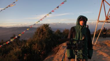 Director Jordan Ehrlich, on a mountain prepping for shoot. Cold film shoot. Beautiful location for film shoot. Nepal India
